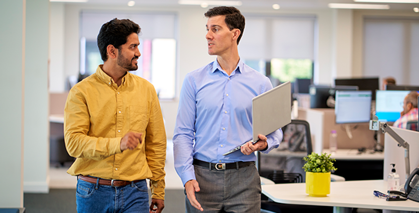 Employees Walking And Talking